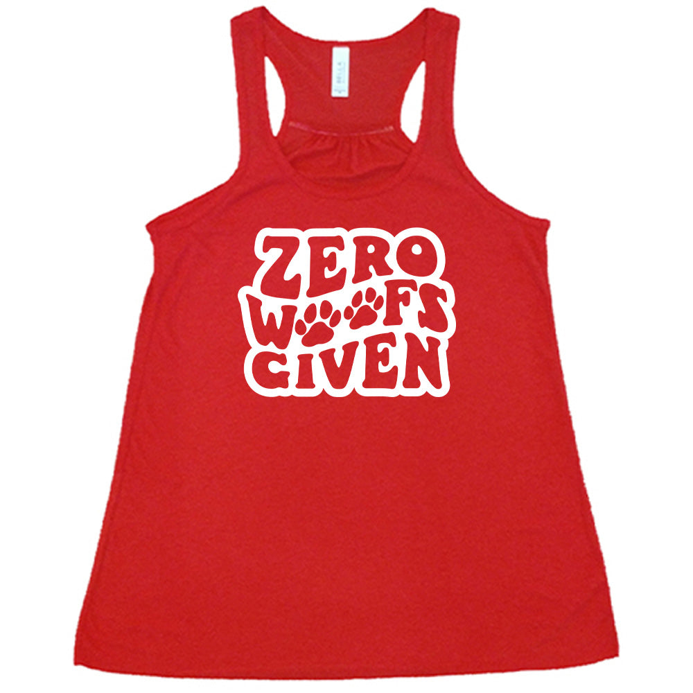 Red colored flowy tank with paw print graphic on it that says "Zero Woofs Given"