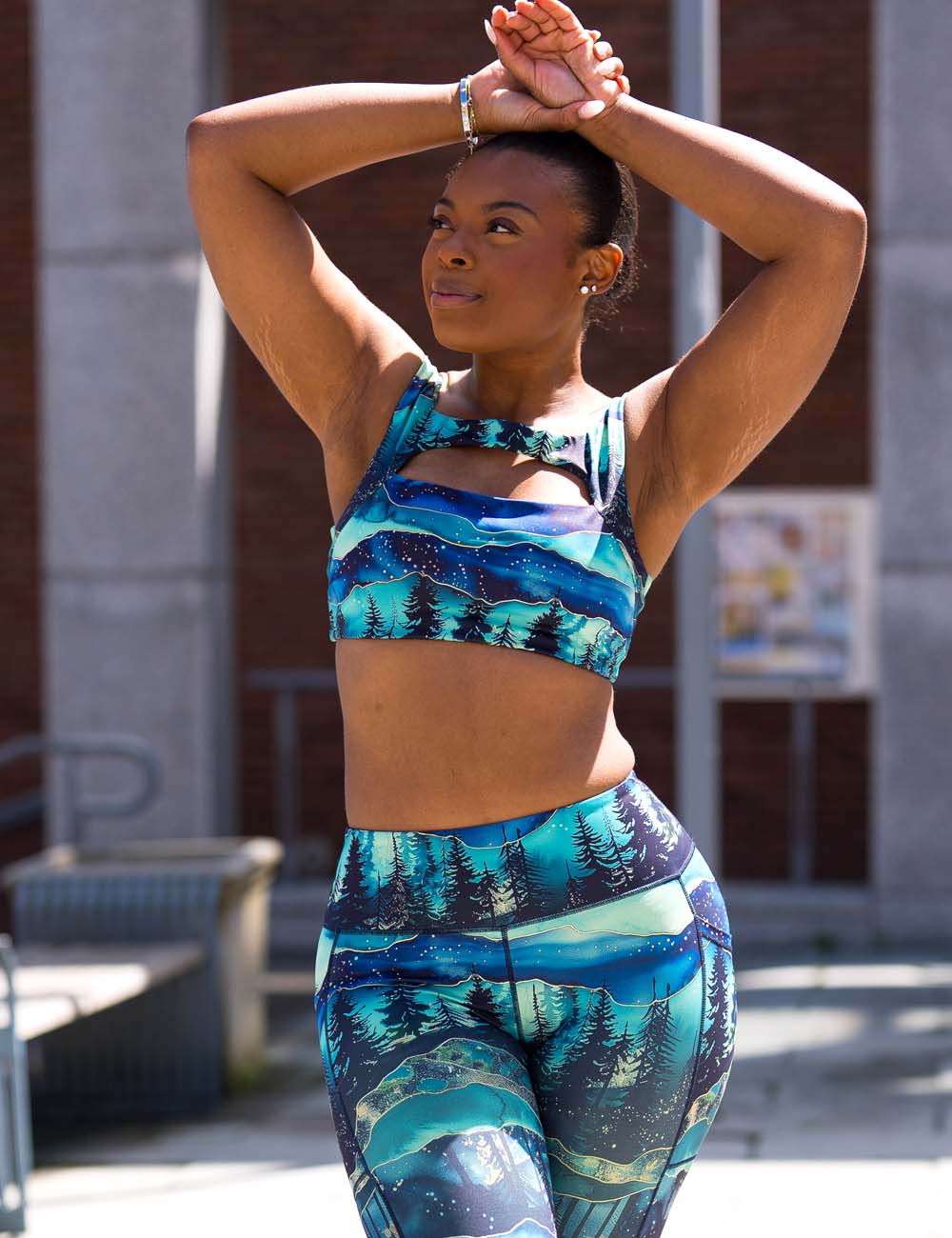 model wearing afterglow bra - a mix of blue colors with a landscape