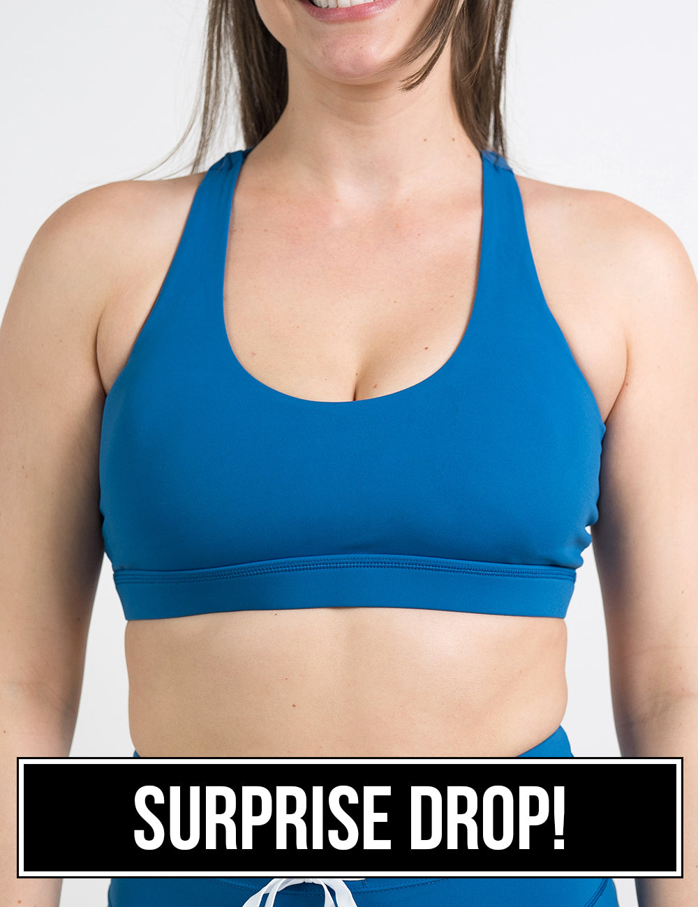 front of the blue butterfly back bra against a white background, surprise drop