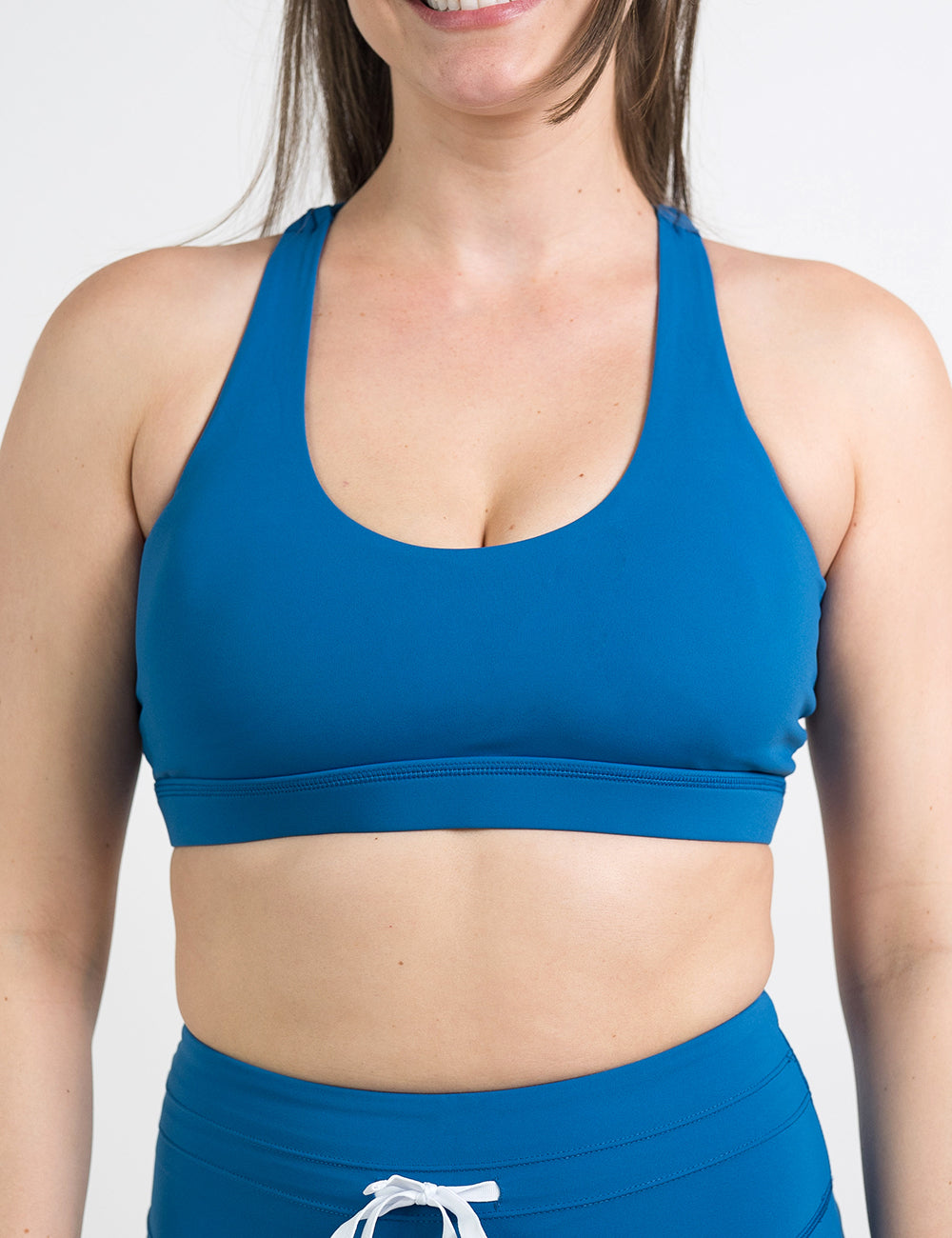 front of the blue butterfly back bra against a white background