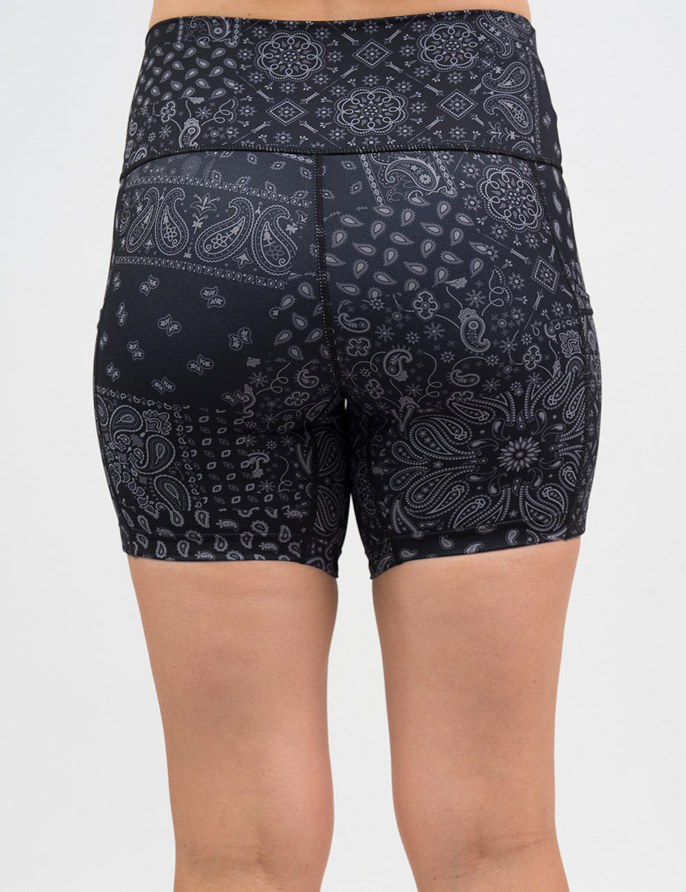 back of the 5 inch black shorts with a white paisley pattern against a white background