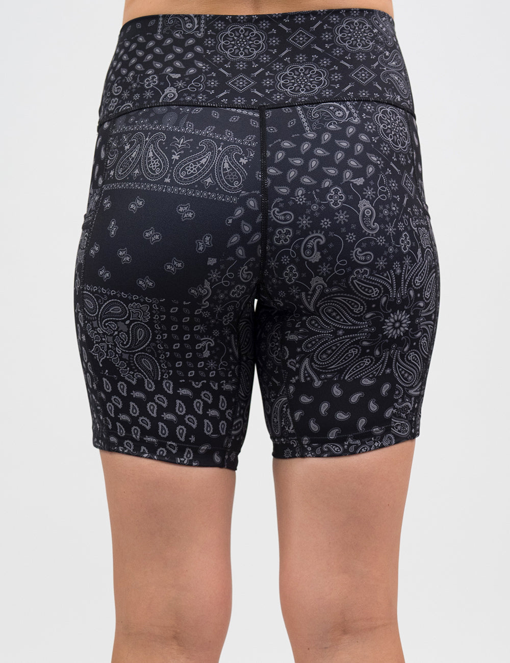 back of the 7 inch black shorts with a white paisley pattern against a white background