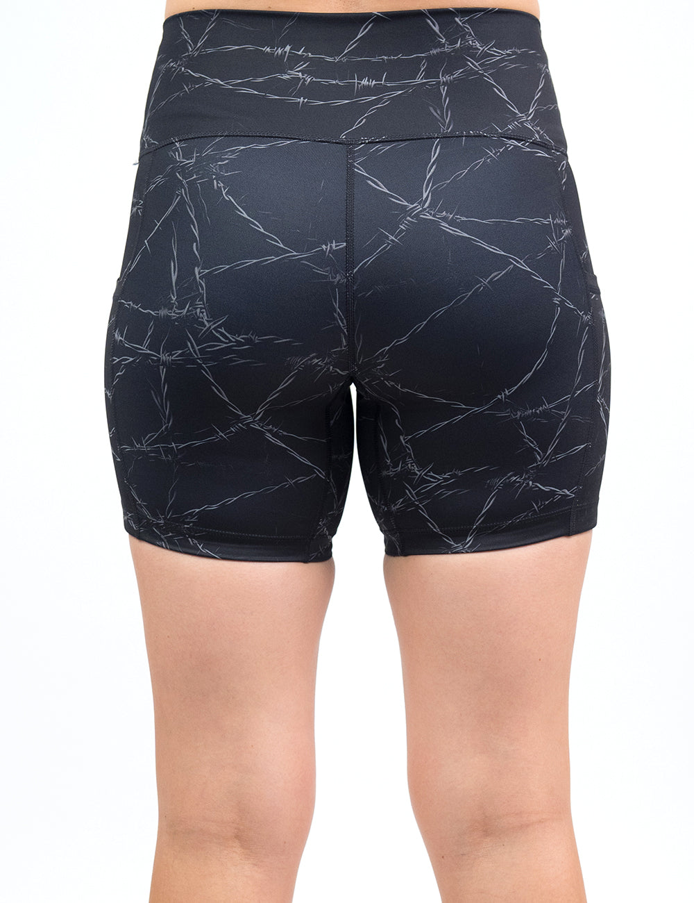 back of the 5 inch black shorts with a white barbed wire pattern on it against a white background