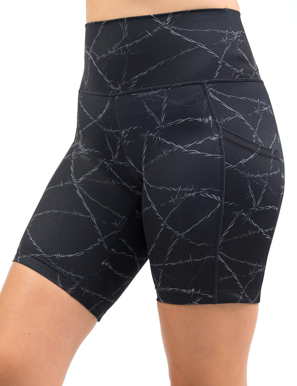 front of the 7 inch black shorts with a white barbed wire pattern on it against a white background