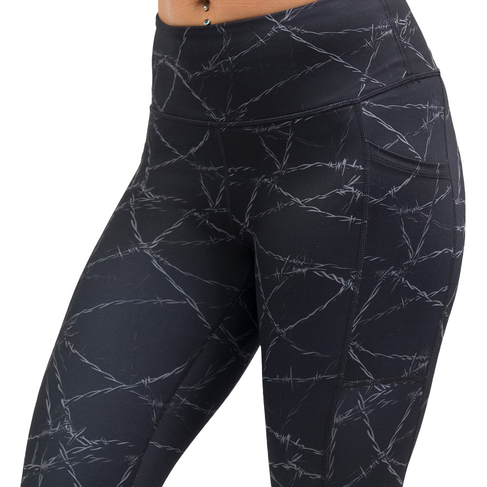 black leggings with a white barbed wire pattern on it