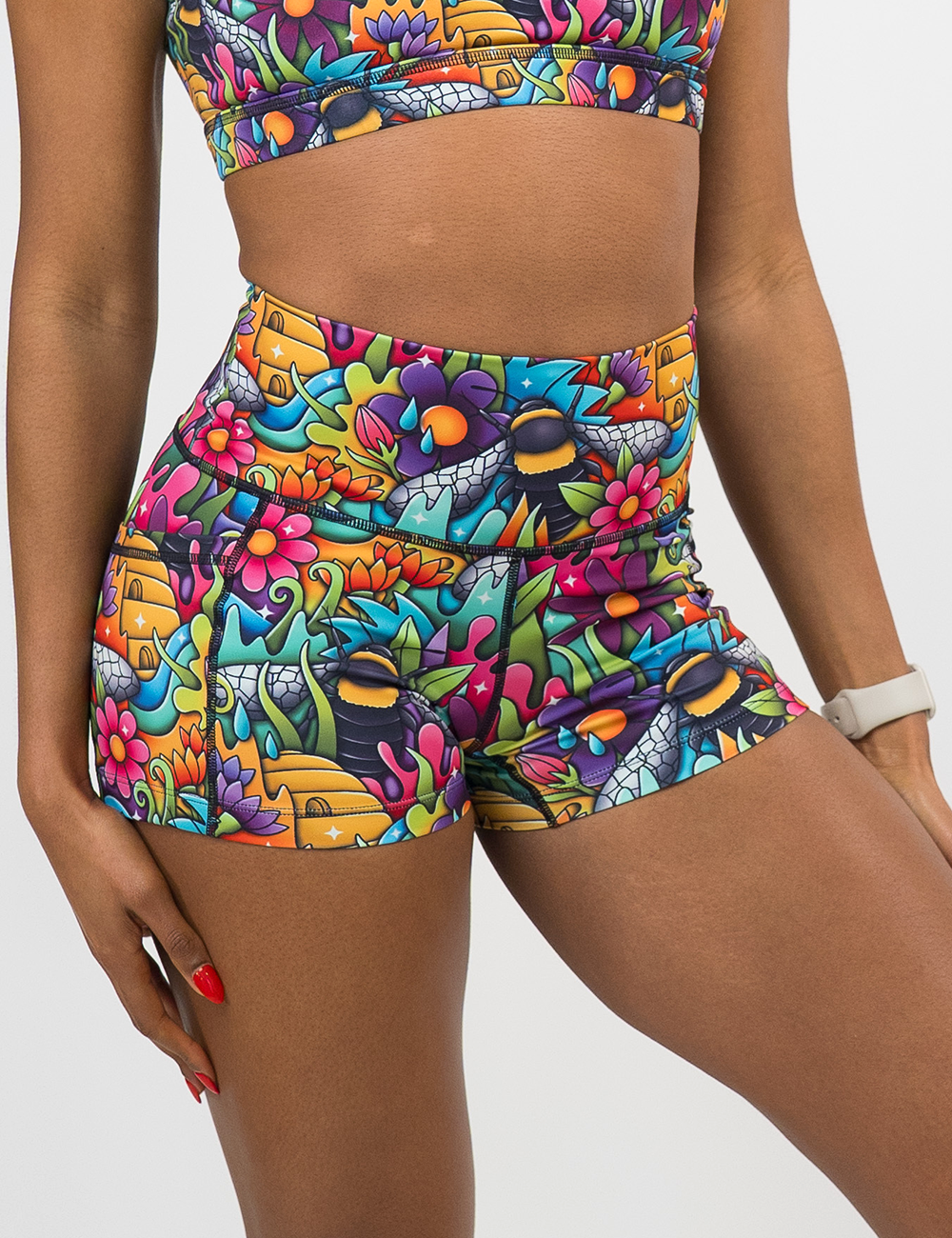 close up of the cartoon bee's pollinating flowers 2.5 inch shorts against a white background