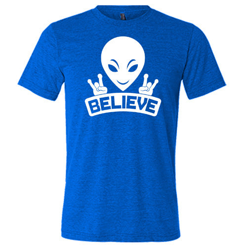 blue unisex shirt that has an alien design on it that says "believe"