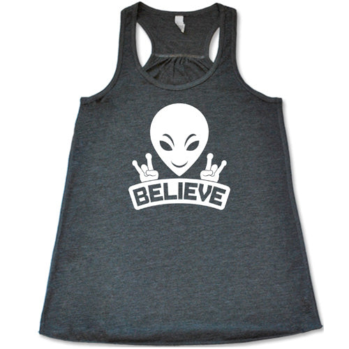 grey racerback tank top that has an alien design on it that says "believe"