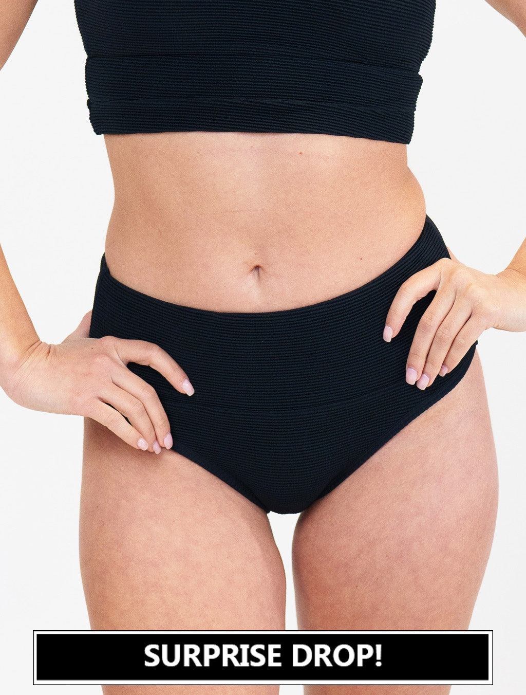 model wearing black bathing suit bottoms