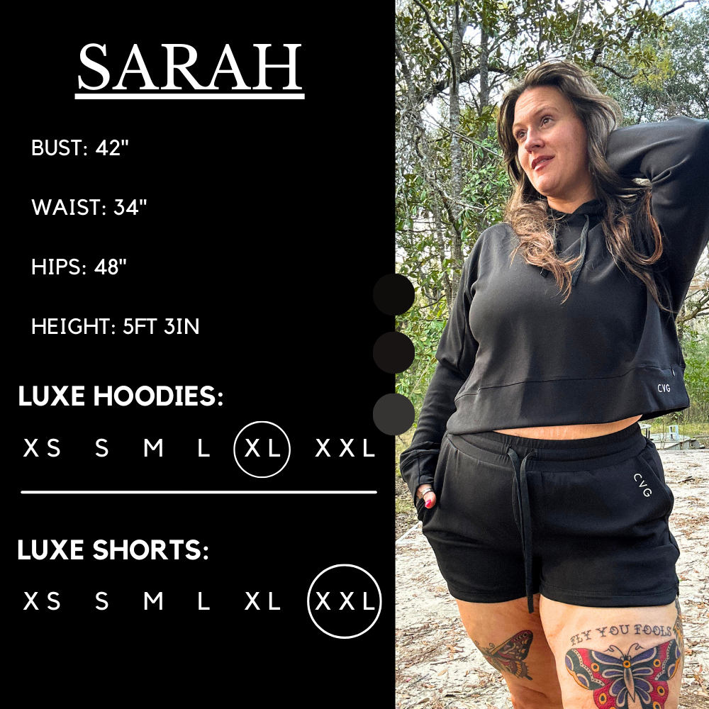 Model’s measurements of 46” bust, 38” waist, 51” hips and height of 5 ft 3 inches. She is wearing a size extra large in our luxe hoodie and a size xxl in our luxe shorts