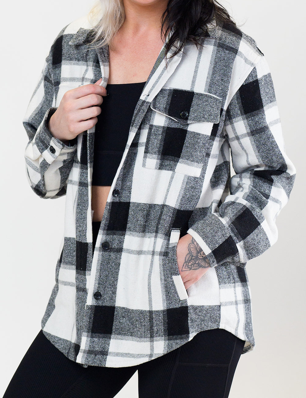 front of the black plaid shacket against a white background
