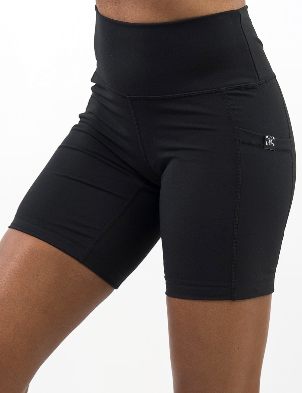 front of the 7 inch solid black shorts against a white background