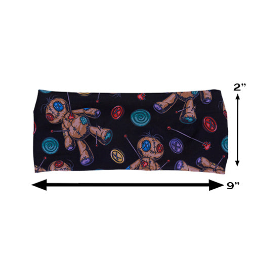 black voodoo doll patterned headband measured at 2 by 9 inches