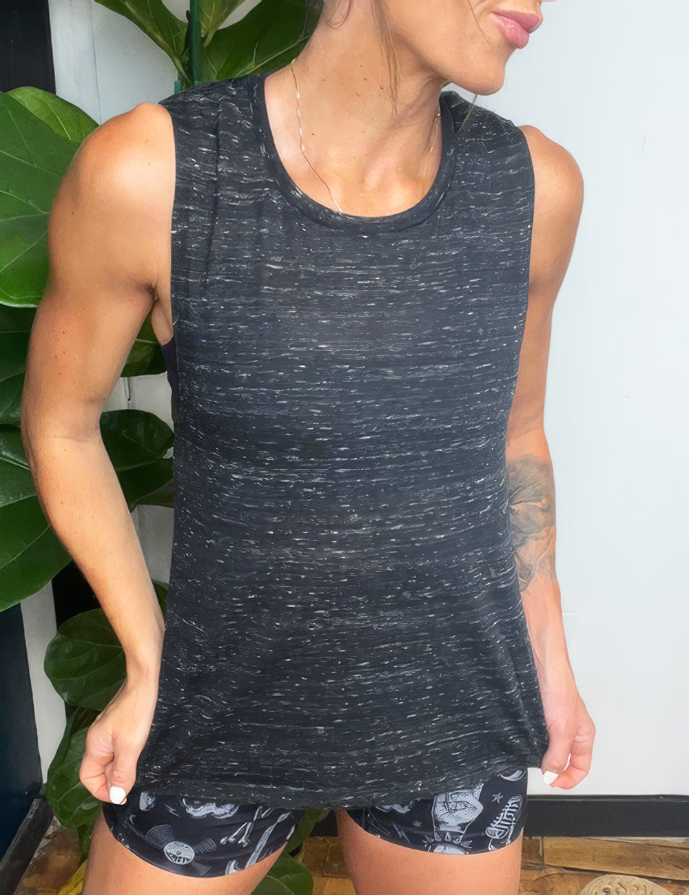 model wearing black marble tank top