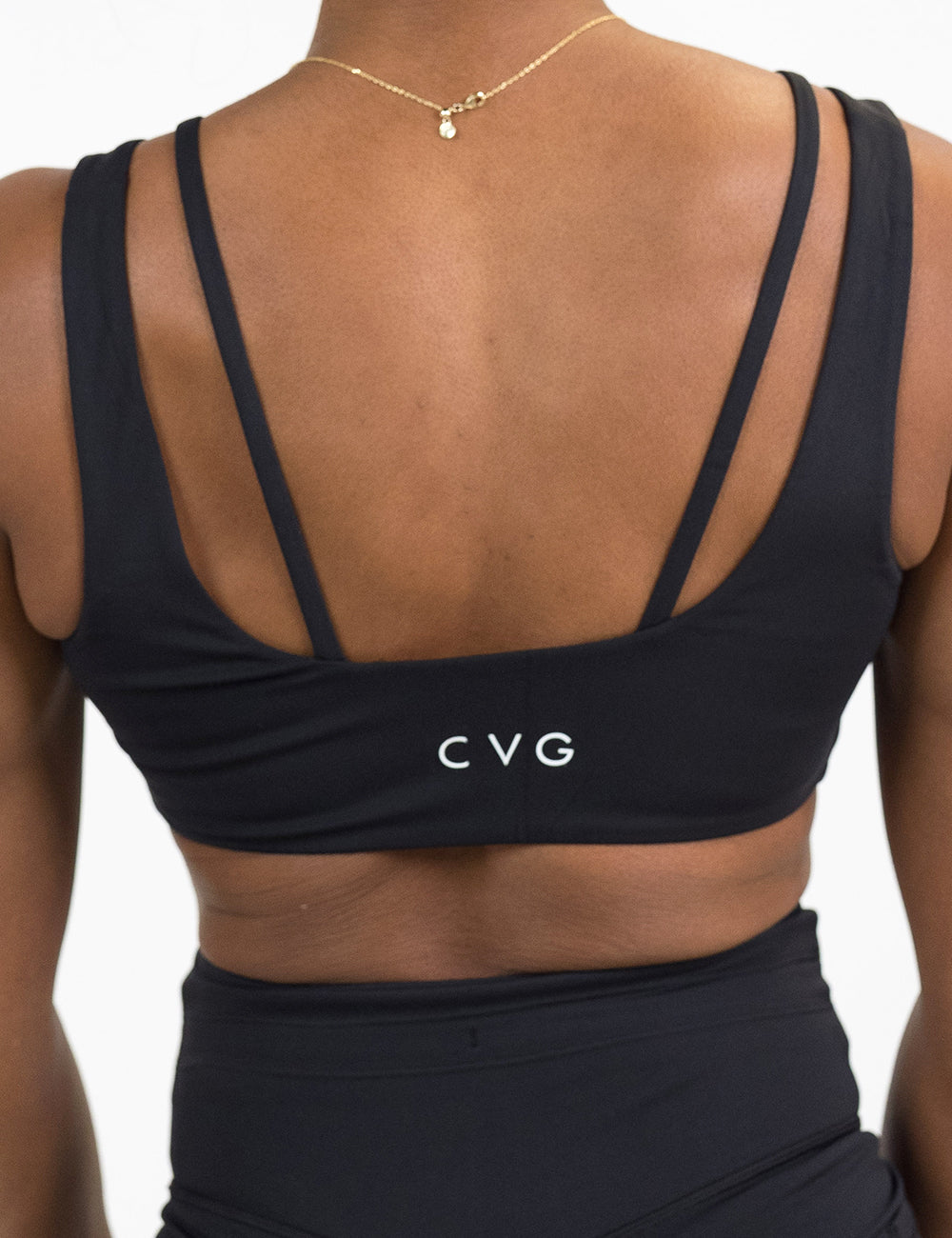 back of the omni black vista bra against a white background