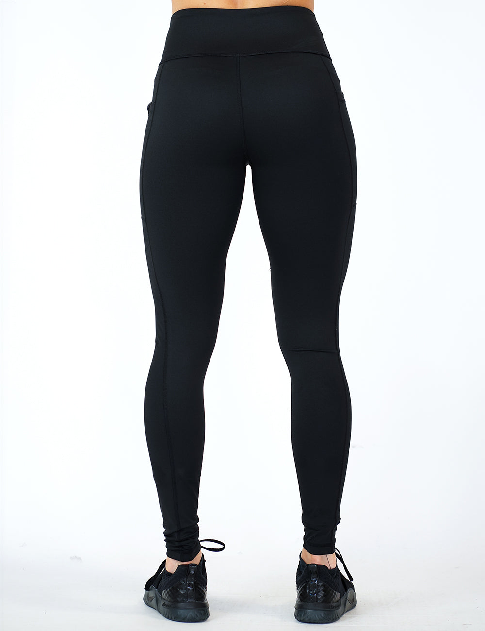 back of the full length solid black leggings against a white background