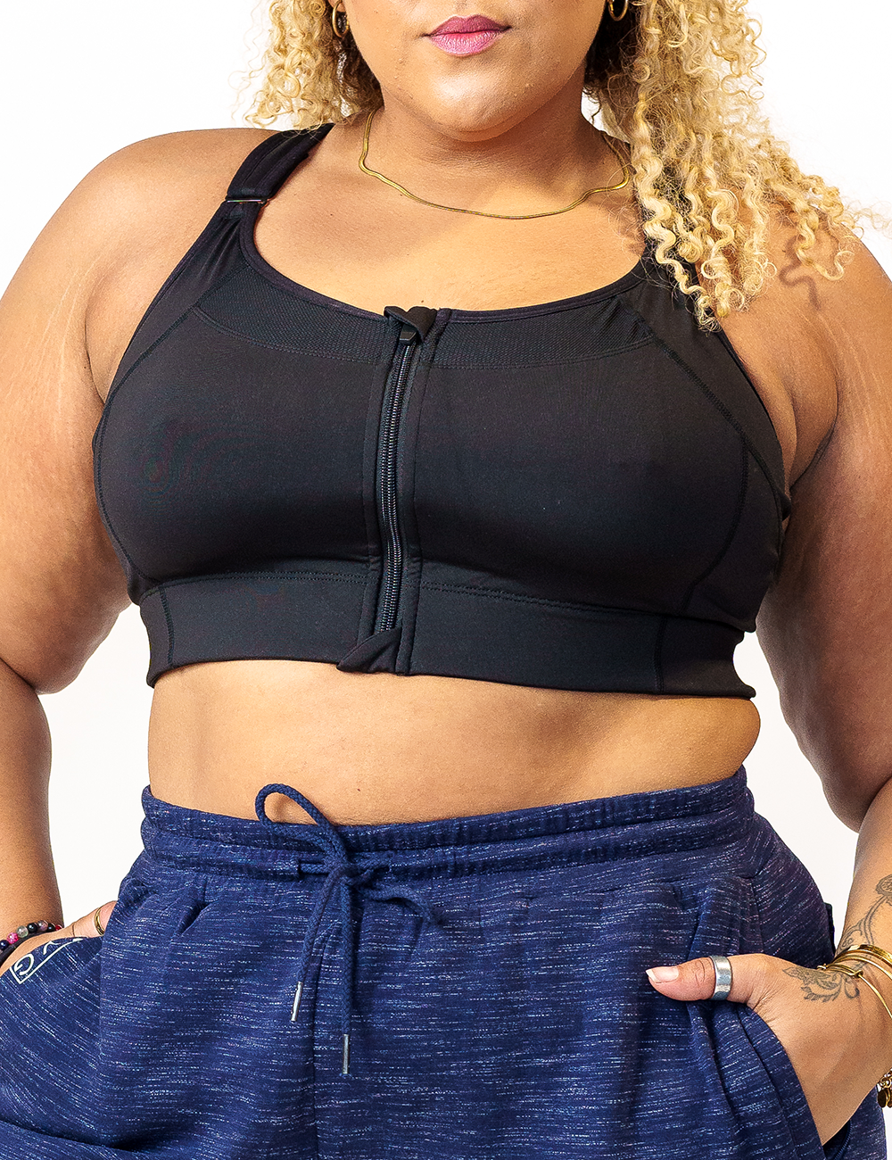 front view of solid black front zipper bra, against a white background