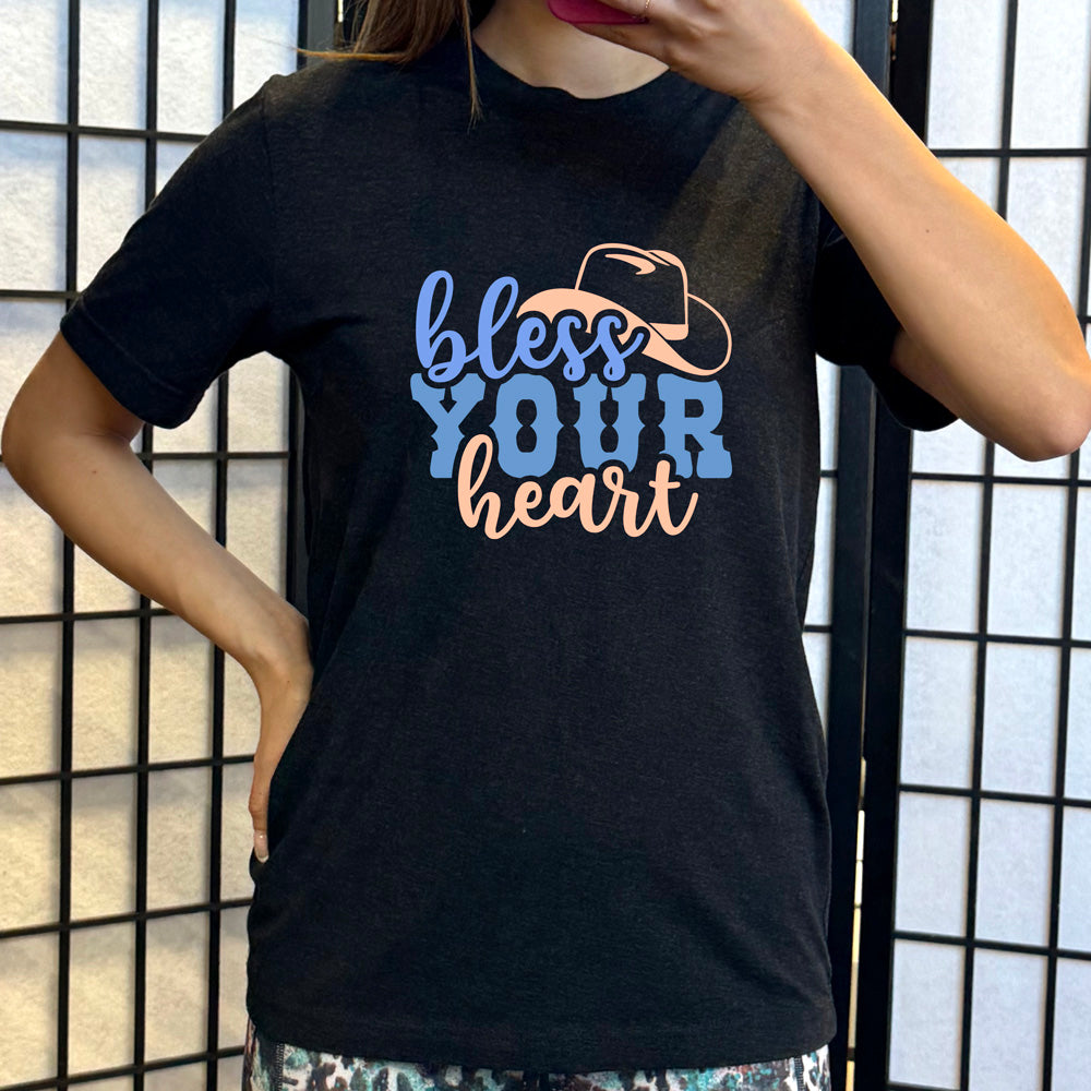 black shirt with a cowboy hat graphic on it that says "Bless Your Heart"