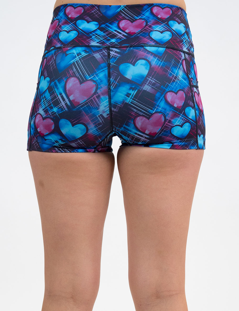 back of the 2.5 inch blue and pink hearts pattern against a dark stitched background shorts against a white background