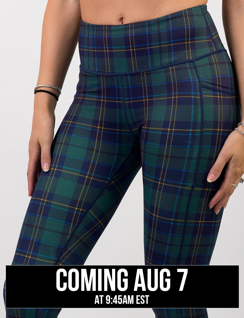 front of the blue, green, and yellow plaid leggings, coming august 7th