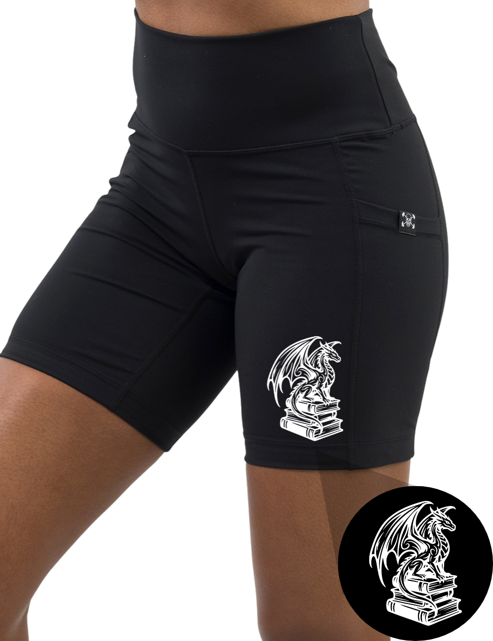 front of the dragon sitting on books graphic 7 inch black shorts against a white background
