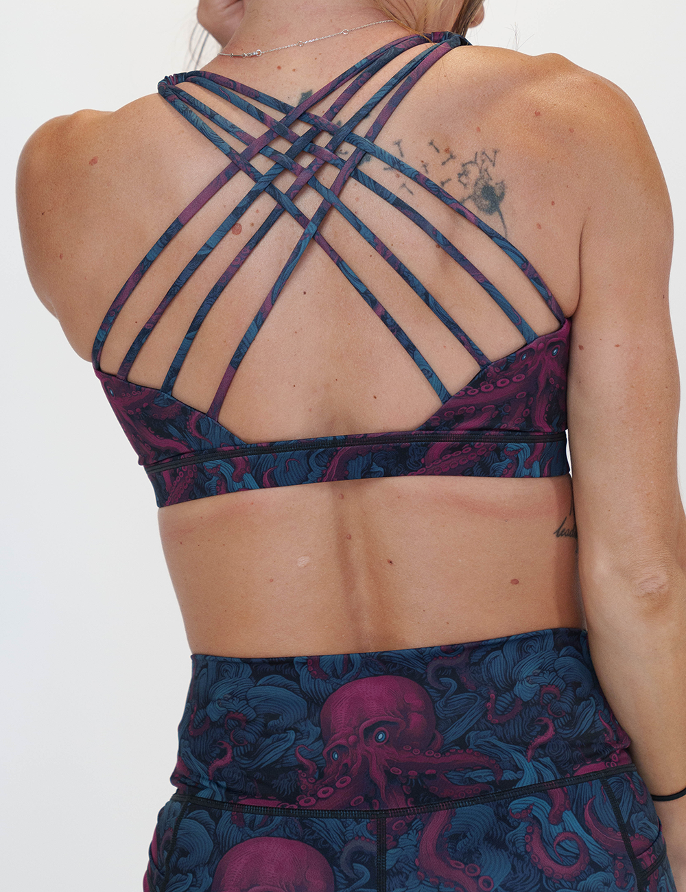 back of the maroon octopus with glowing blue eyes butterfly back bra