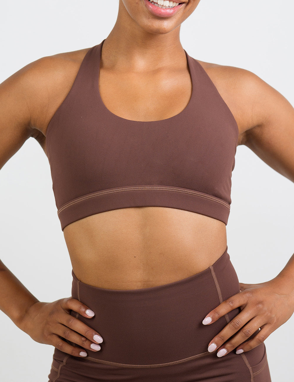 front of the solid light brown sports bra