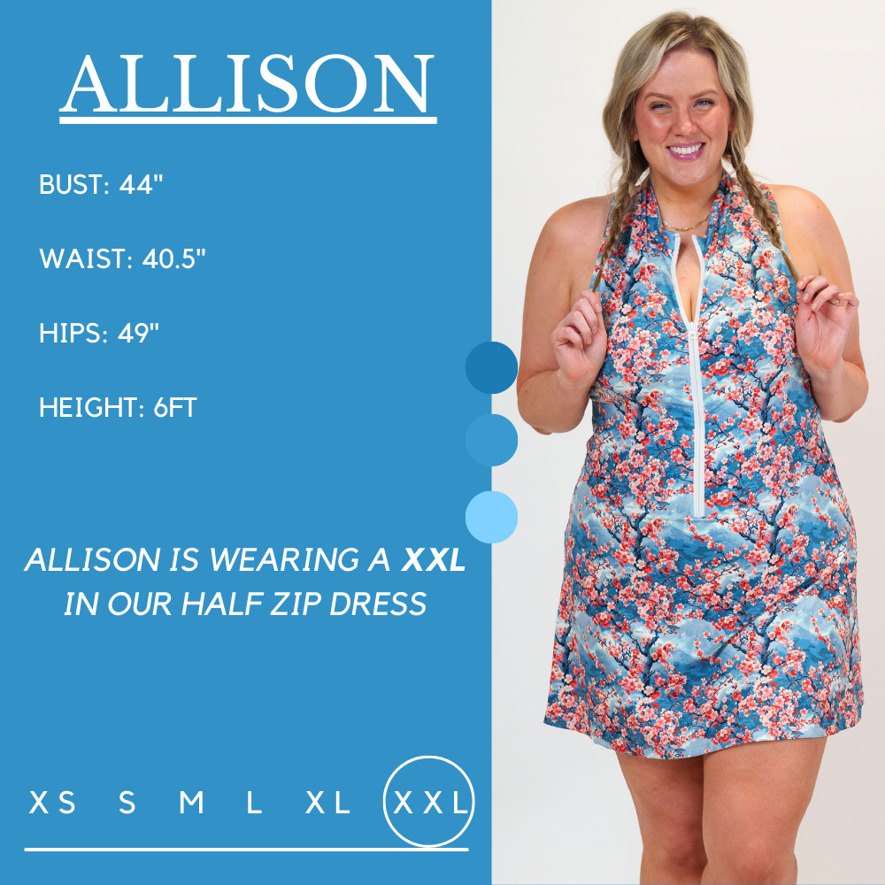 Model's measurements of 44 inch bust, 40.5 inch waist, 49 inch hips, and height of 6 foot. She is wearing a size xx-large in our half zip dress