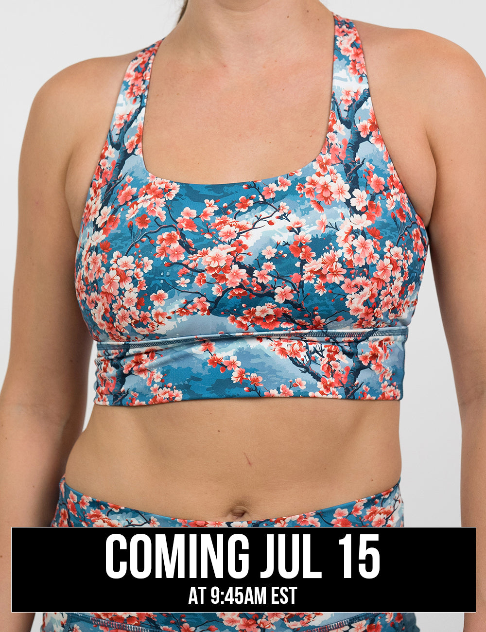 front of blooming cherry tree print longline bra against a white background, coming july 15th