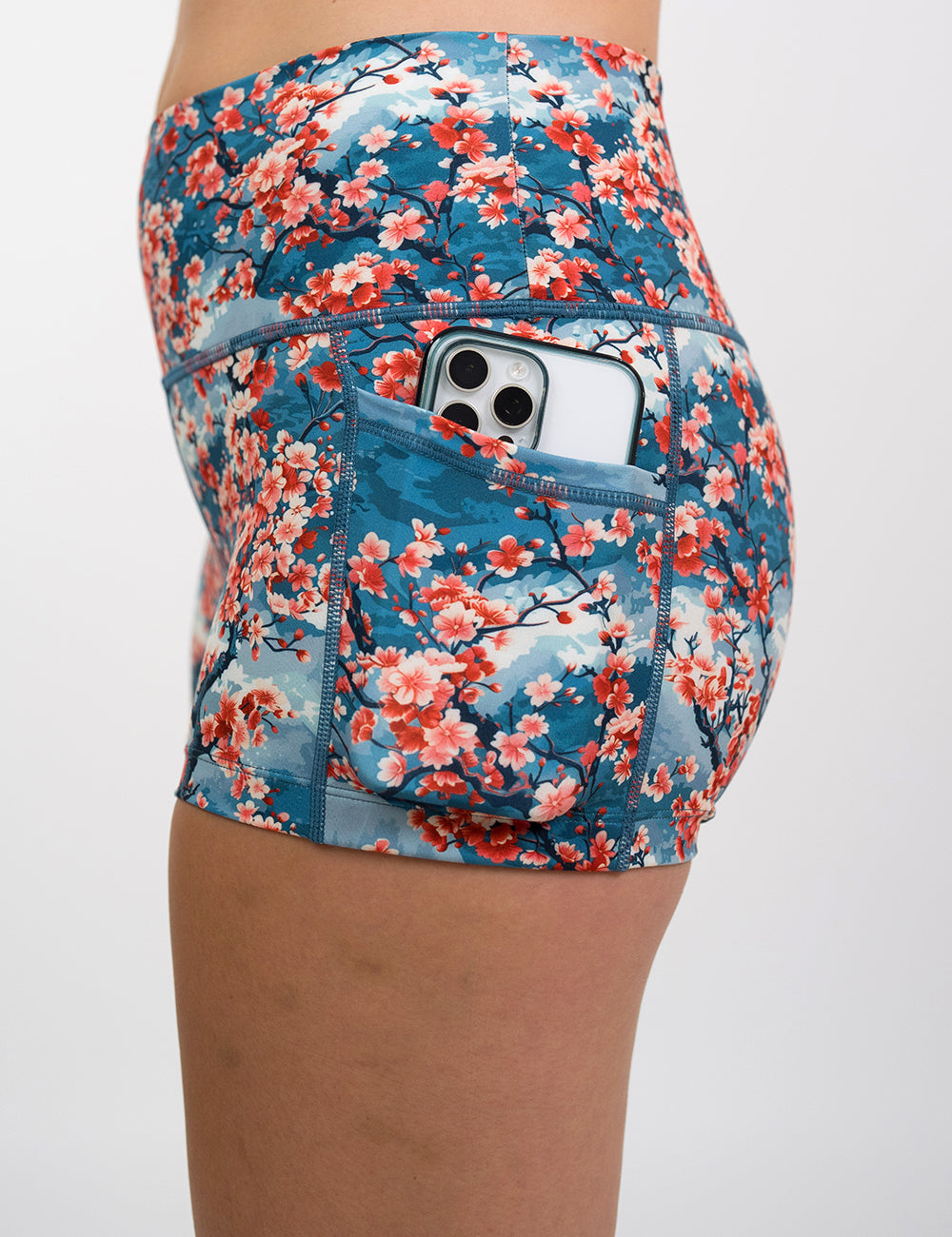 close up of the 2.5 inch cherry tree shorts with a phone in the pocket against a white background