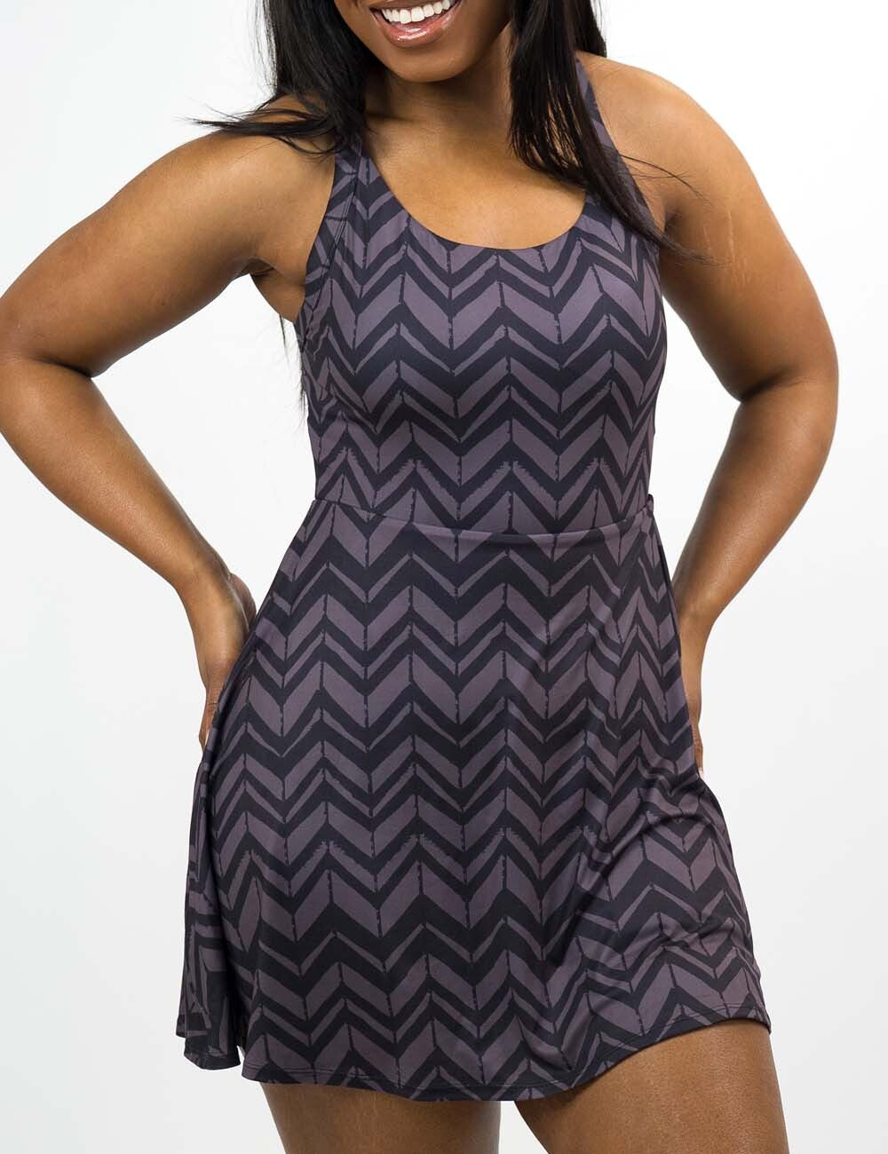 front of the grey arrows against a black background active dress, against a white background