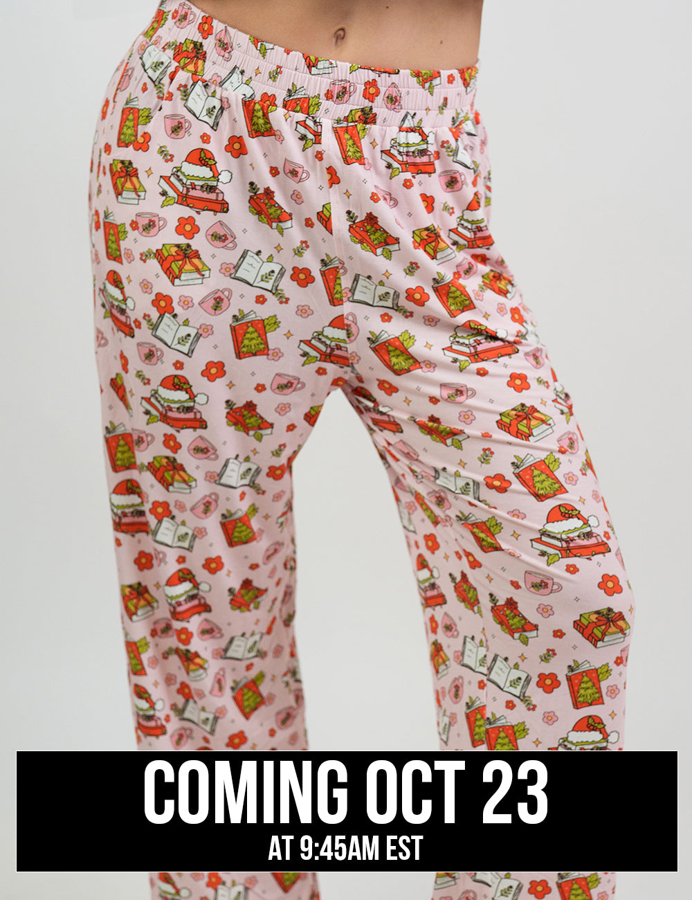 close up of the Christmas books and flowers all over pink pajama bottoms, coming October 23