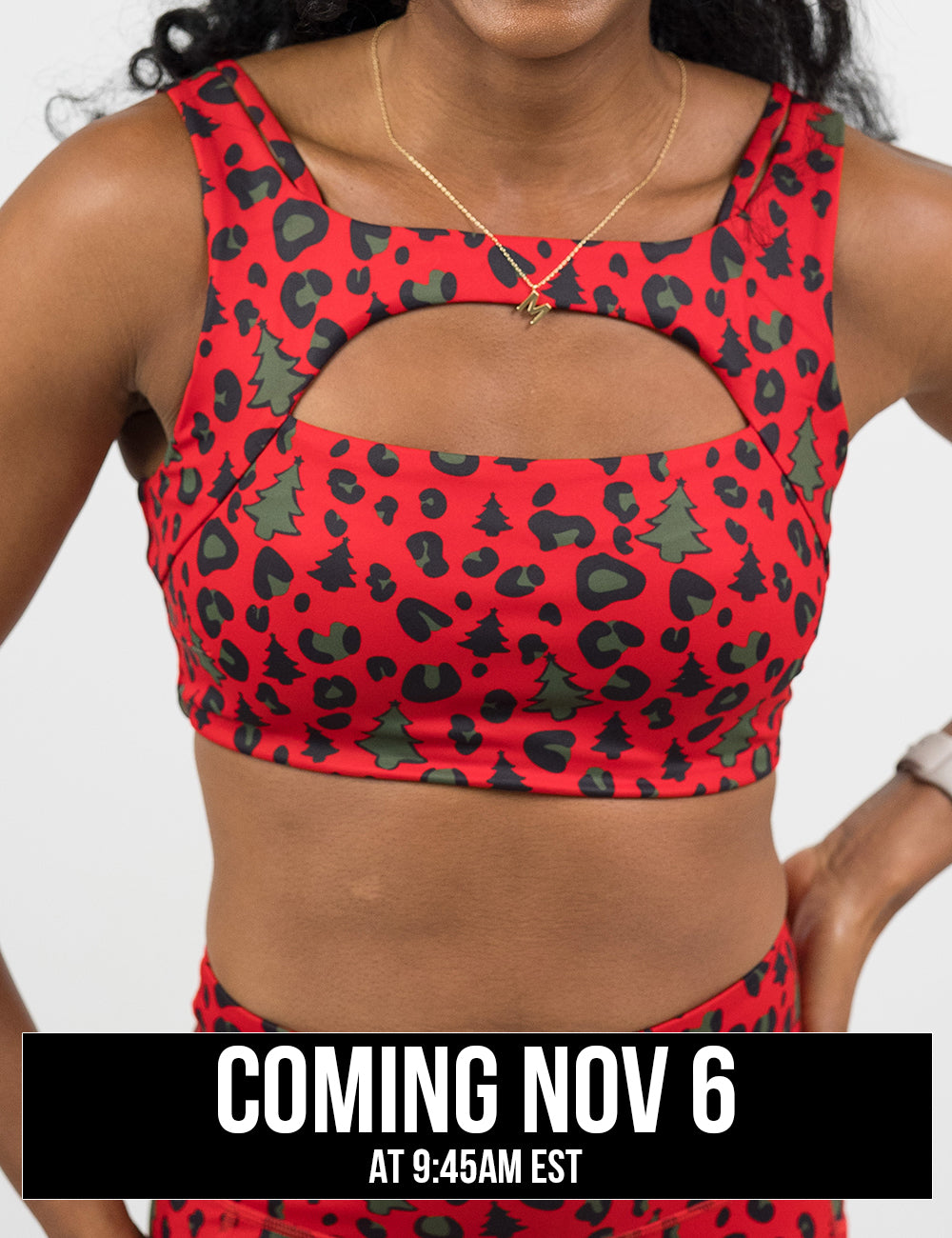 front of the red and brown Christmas trees and leopard print sports bra coming November 6th