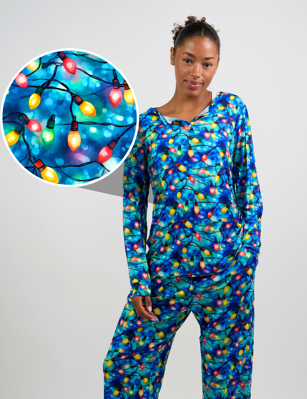 model wearing the red, yellow, and green Christmas lights pajama top and bottom, with a close up graphic showing the print in detail
