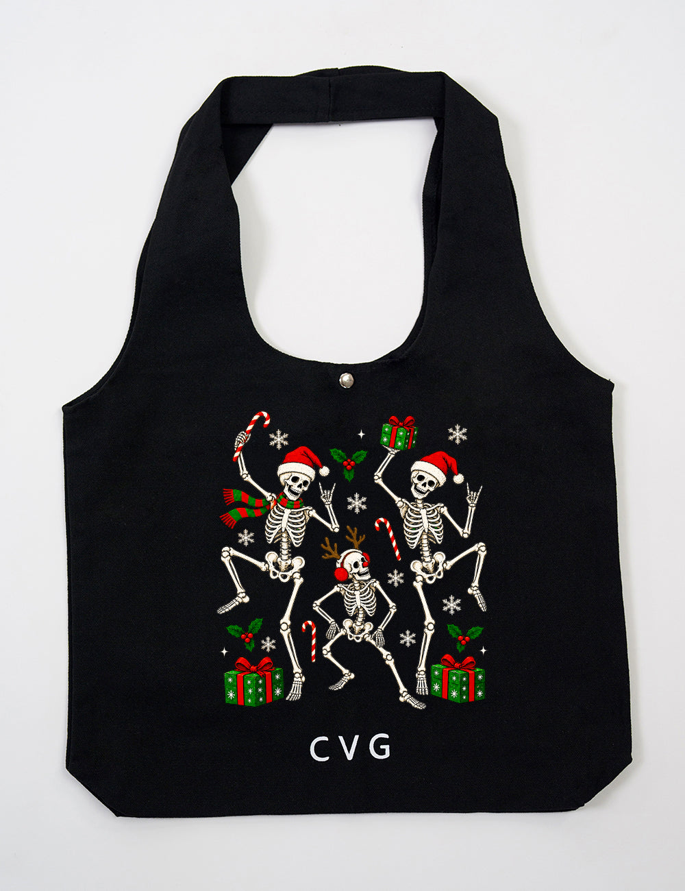 Black tote bag with the CVG logo featuring the festive skeleton's dancing graphic