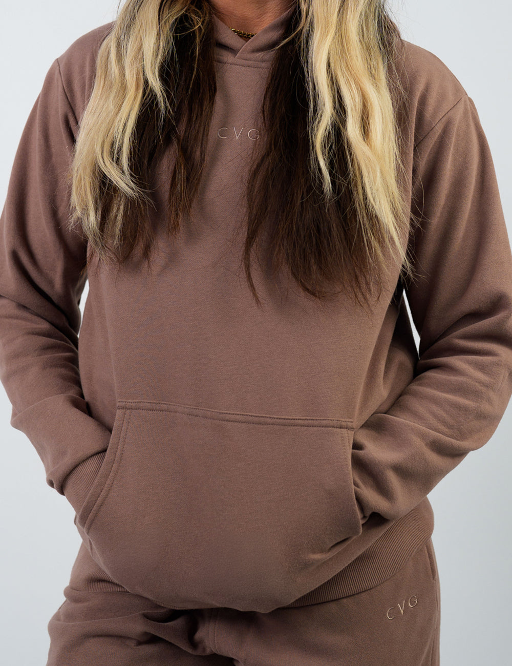 front of the brown hoodie with a subtle CVG logo