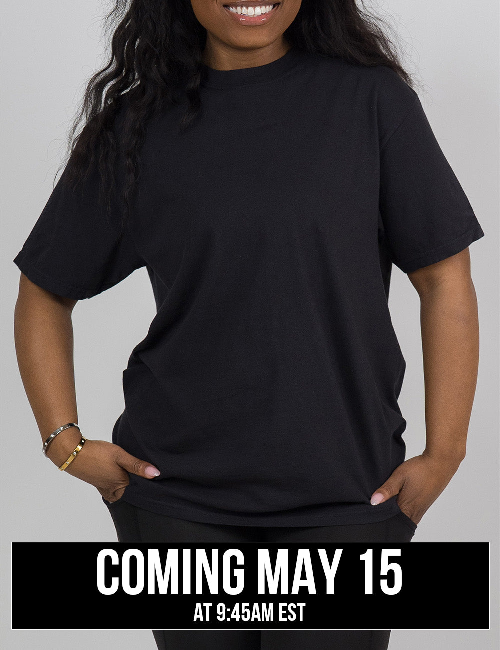 model wearing the black tee facing the front