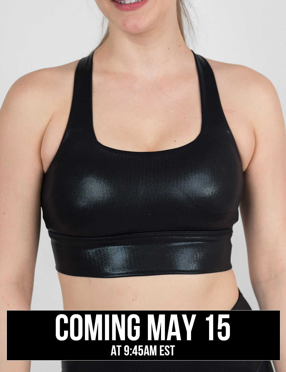 front of the black leather longline bra against a white background, coming may 15th