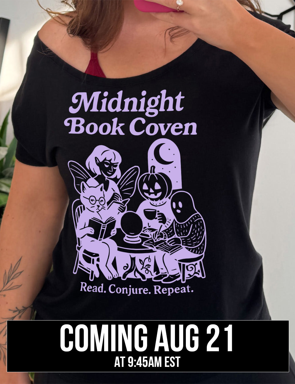 black slouchy tee with words "midnight book coven" above the graphic of a tombstone with a moon on it, a fairy reading a book, a pumpkin head person drinking coffee with a book, a ghost wearing a sweater and writing in a journal, and a humanoid cat wearing glasses, giving side-eye, and reading a book, all around a table with a crystal ball on top, and the words underneath saying "read. conjure. repeat." coming august 21st
