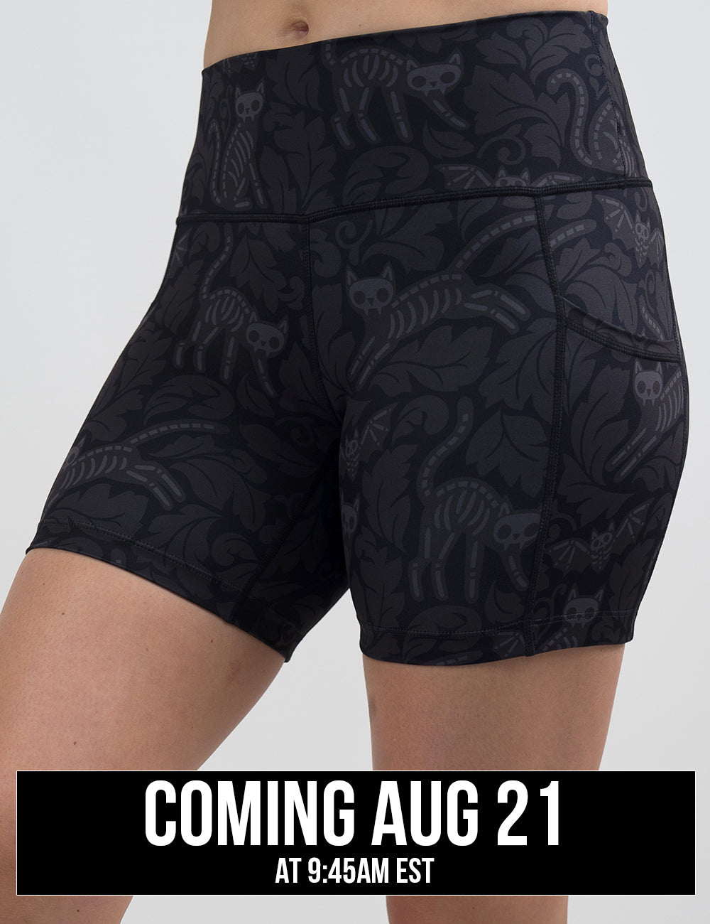 front of the 5 inch black and grey bats and cats skeleton shorts against a white background, coming august 21st