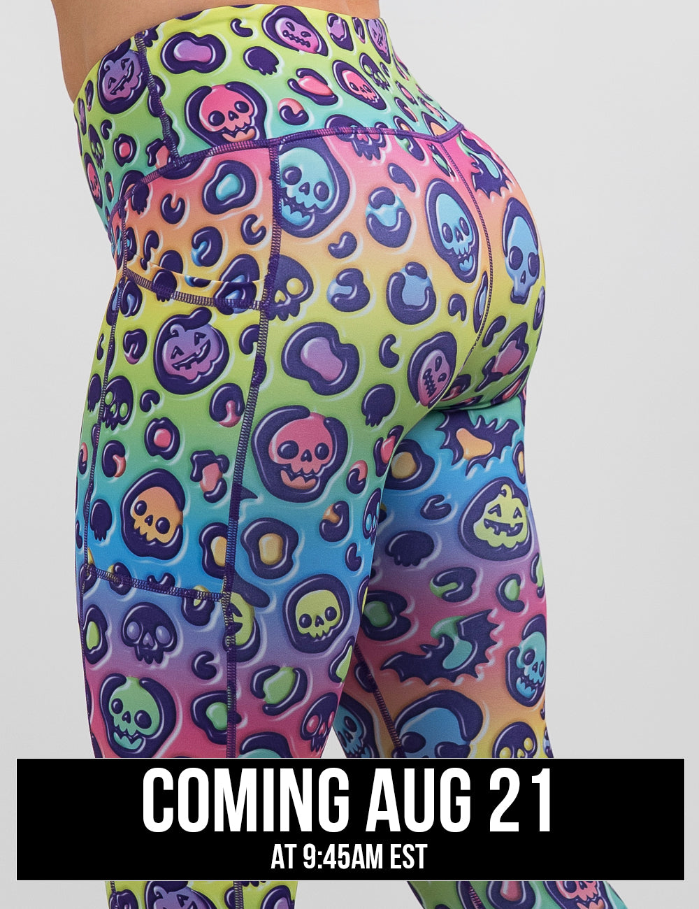 side view of the rainbow leopard print pumpkins and skulls leggings against a white background, coming august 21st