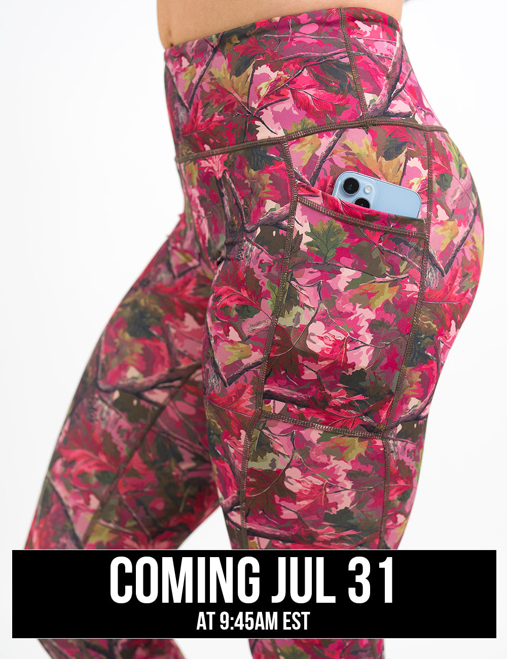side view of the pink forest camo leggings with a phone in its pocket coming july 31st