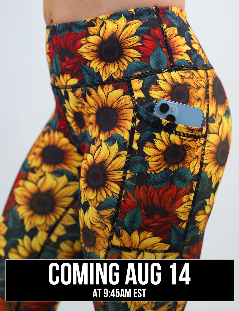front of the sunflower with red flowers leggings with a phone in its pocket coming august 14th