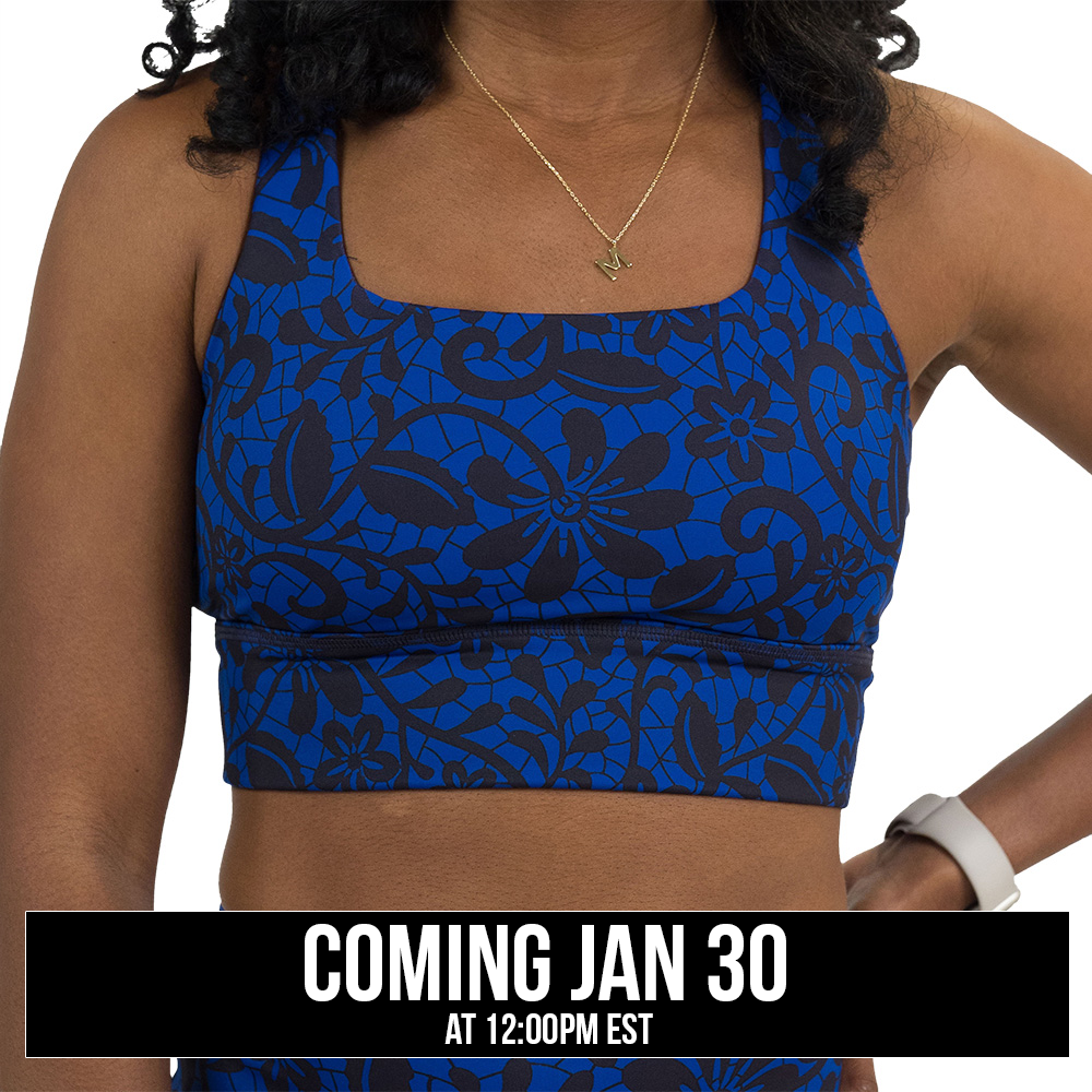 black floral against a dark blue background longline bra coming soon
