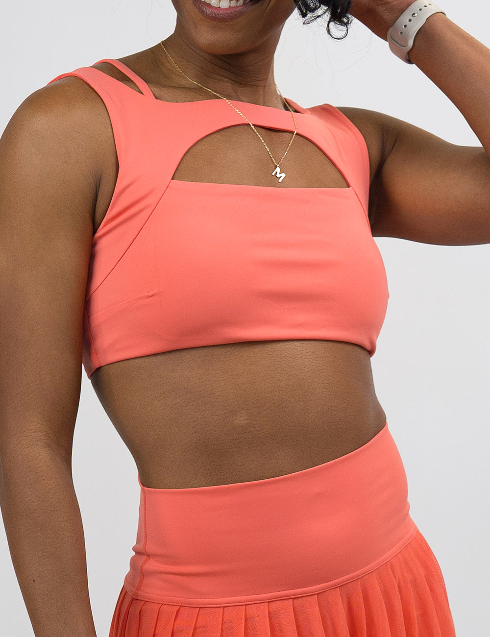 front of the solid orange vista bra against a white background, surprise drop