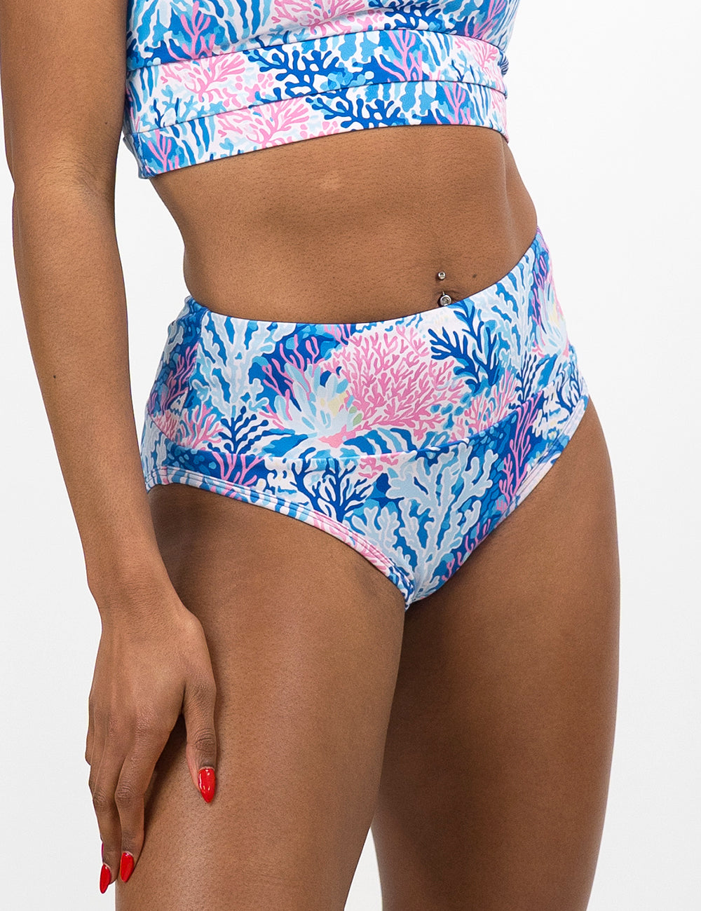front of the pink and blue coral swimsuit bottoms against a white background