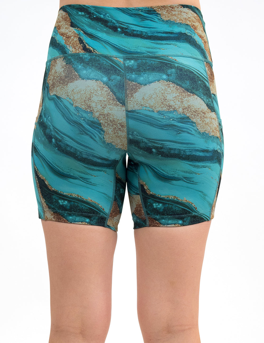 back of the 5 inch blue ocean with gold streaks patterned shorts against a white background