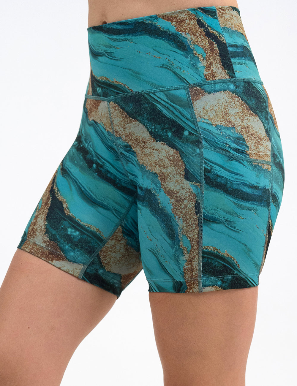 front of the 5 inch blue ocean with gold streaks patterned shorts against a white background
