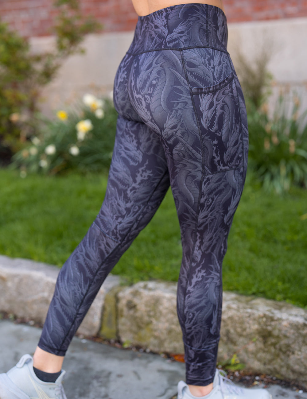 back of the full length black leggings with grey dragons