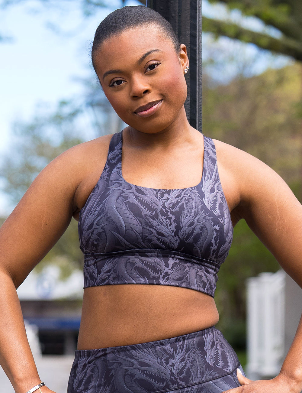 model wearing the black longline bra with grey dragon patterns